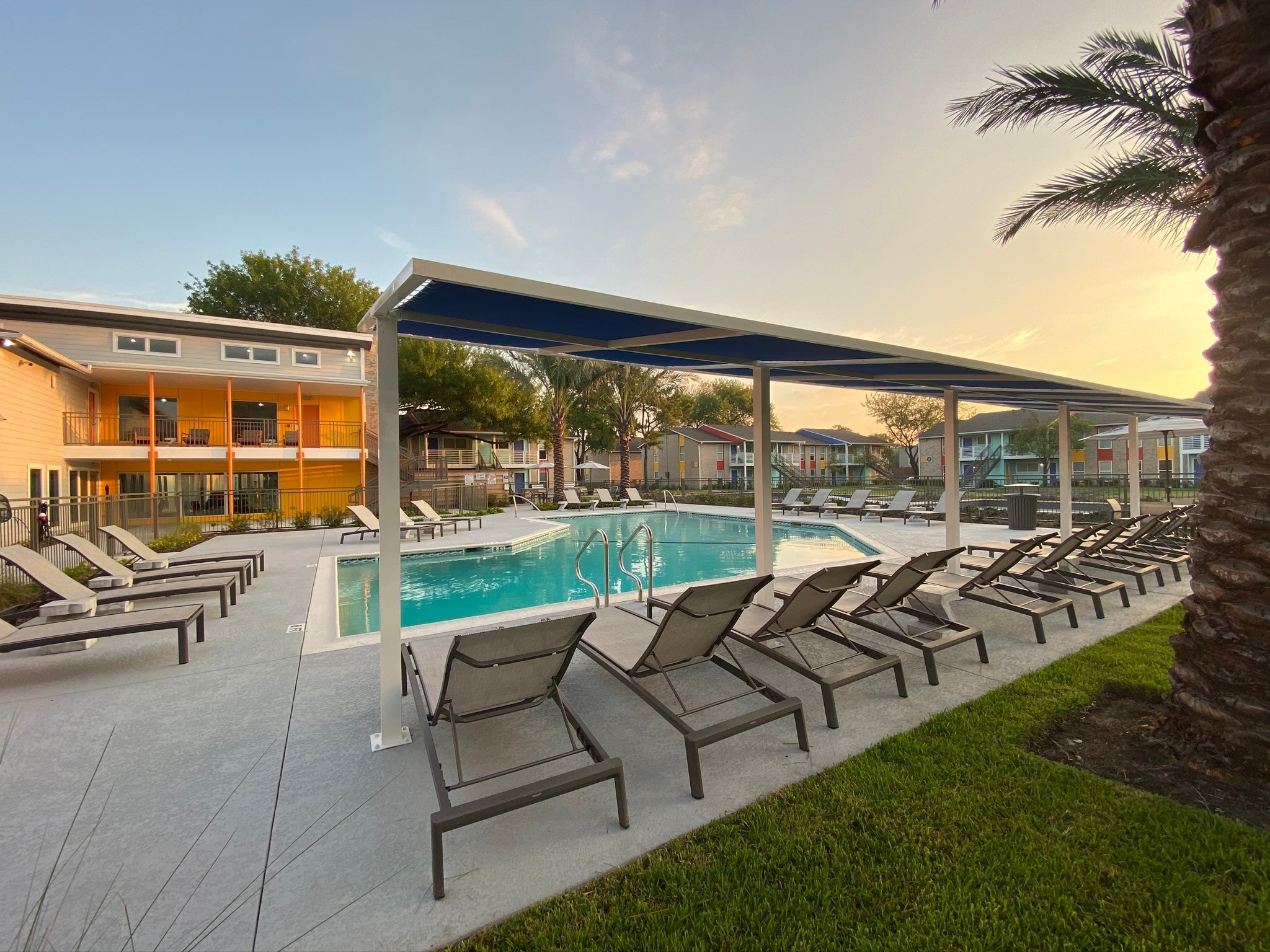 8787 Hammerly Boulevard, Unit 222 Houston, TX 77080 - Photo 35 of 39 a view of a patio with lawn chairs floor to ceiling window and wooden floor