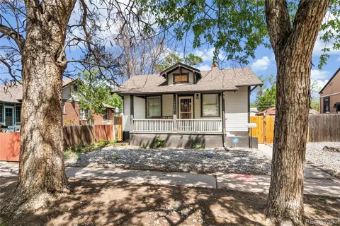 a house with trees in front of it