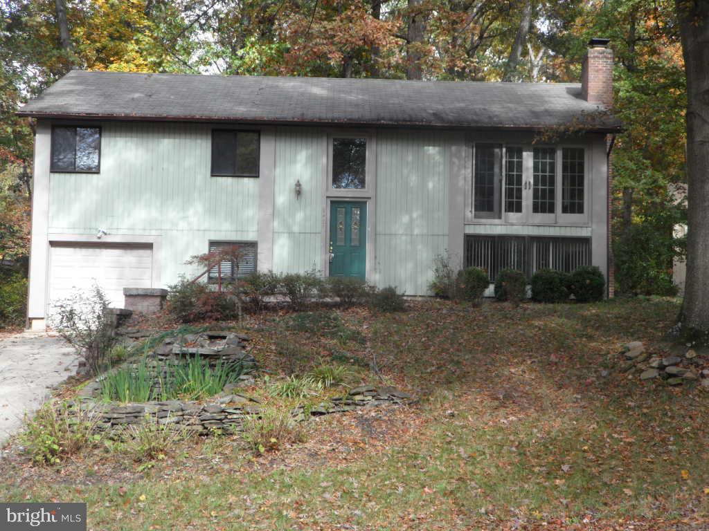 9485 Good Lion Road Columbia, MD 21045 - Photo 1 of 20 a front view of a house with a yard