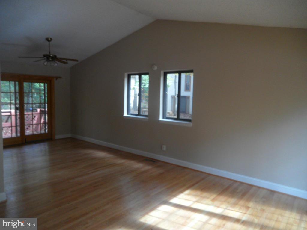 9485 Good Lion Road Columbia, MD 21045 - Photo 11 of 20 a view of an empty room with wooden floor and a window