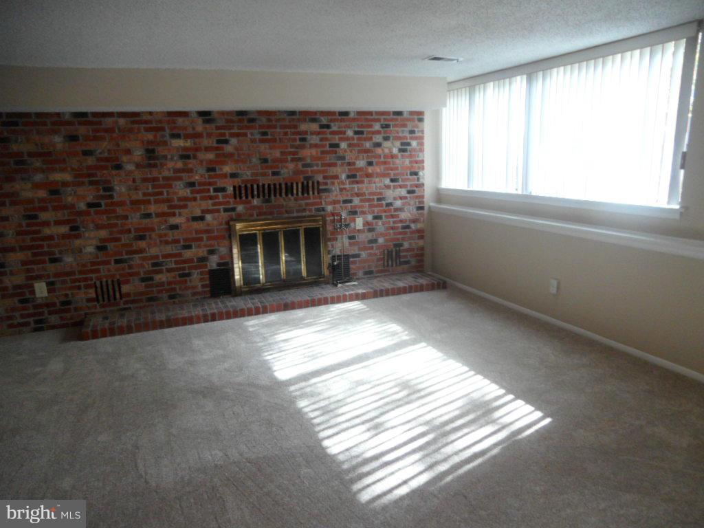 9485 Good Lion Road Columbia, MD 21045 - Photo 18 of 20 a view of empty room with a fireplace
