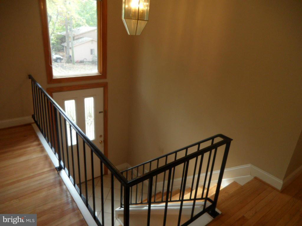 9485 Good Lion Road Columbia, MD 21045 - Photo 9 of 20 a view of staircase with railing and a window