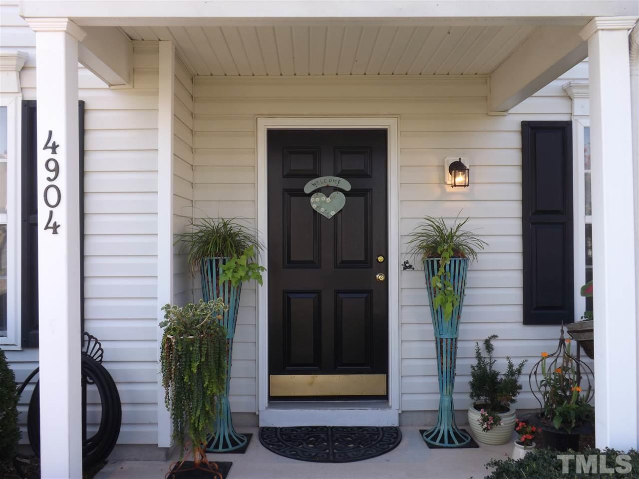 4904 Marathon Lane Raleigh, NC 27616 - Photo 2 of 25 a front view of a house with a potted plant