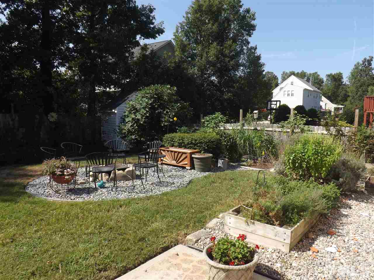 4904 Marathon Lane Raleigh, NC 27616 - Photo 20 of 25 a view of a backyard with plants and patio