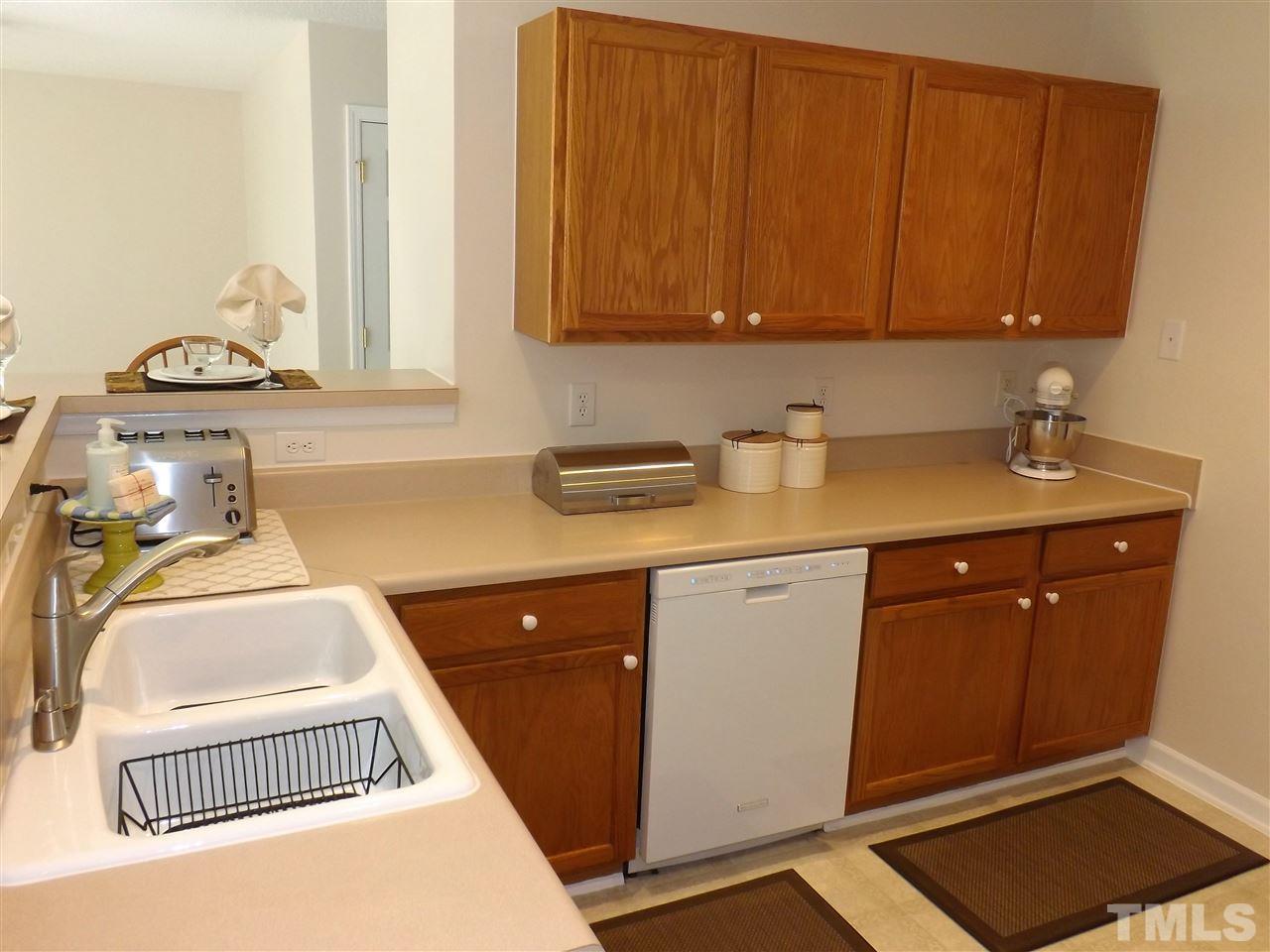 4904 Marathon Lane Raleigh, NC 27616 - Photo 7 of 25 a utility room with sink dryer and washer