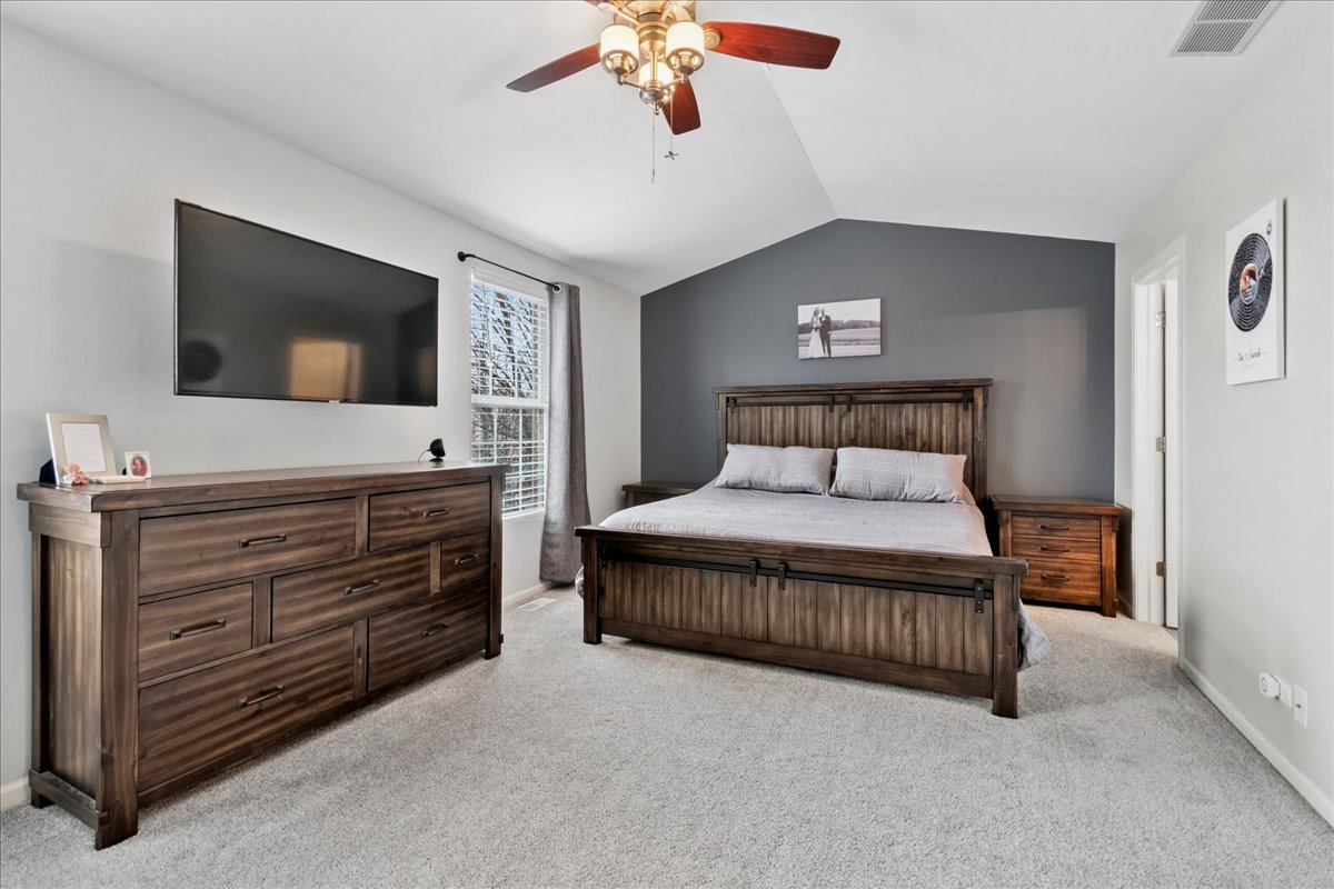 2459 Anna Way Elgin, IL 60124 - Photo 11 of 20 a bedroom with a bed and a flat screen tv