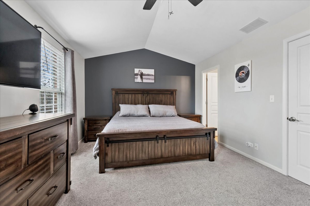 2459 Anna Way Elgin, IL 60124 - Photo 13 of 20 a bedroom with a bed and a flat tv screen on dresser