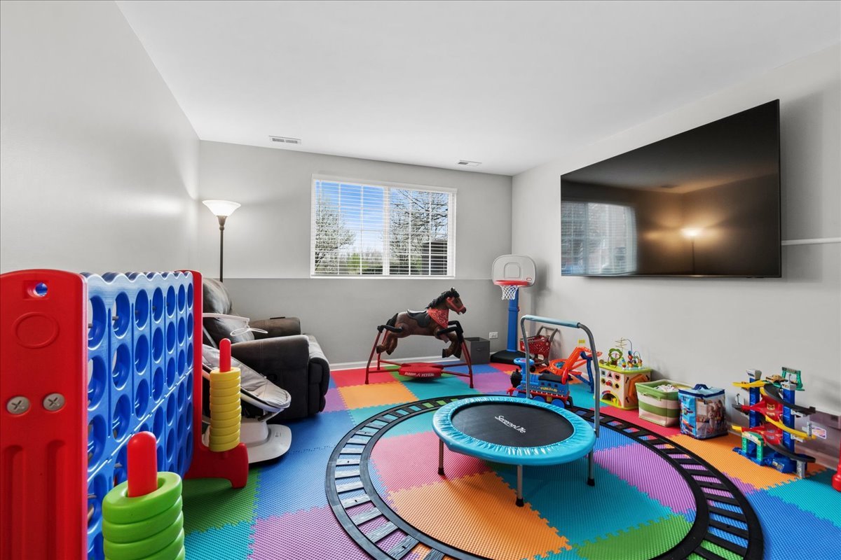 2459 Anna Way Elgin, IL 60124 - Photo 17 of 20 a room with toys and wooden floor