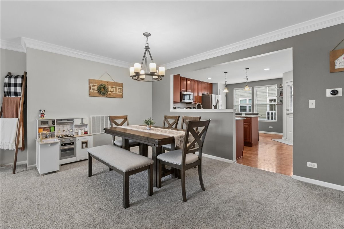 2459 Anna Way Elgin, IL 60124 - Photo 6 of 20 a view of a dining room with furniture