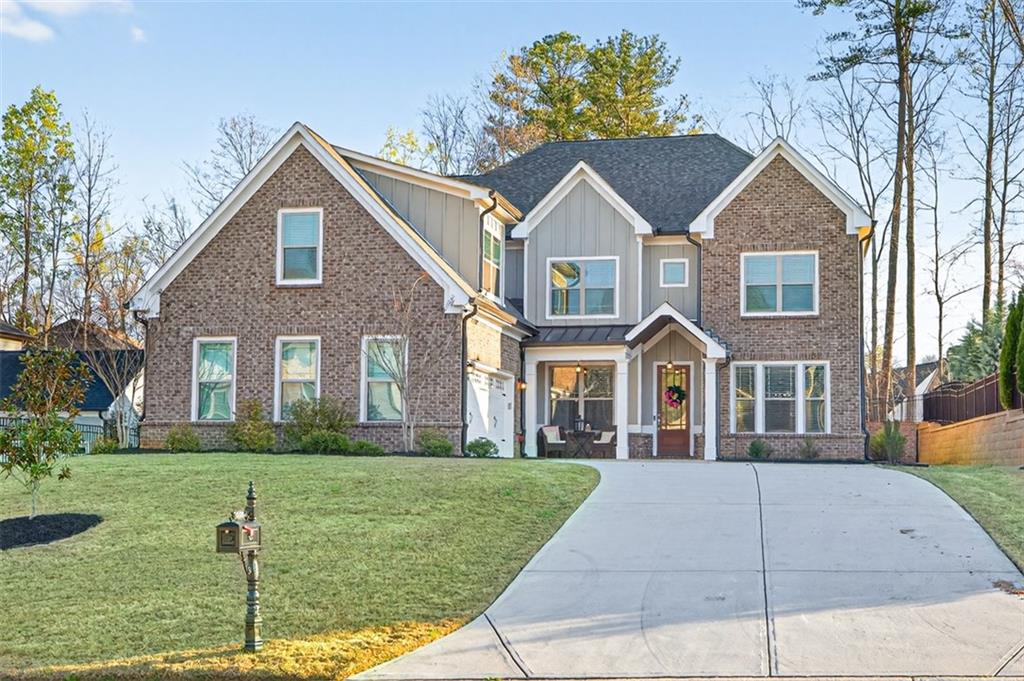 a front view of a house with a yard