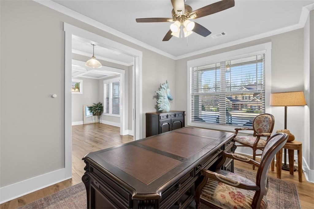 2588 Traditions Way Jefferson, GA 30549 - Photo 13 of 84 a view of a dining room with furniture window and wooden floor
