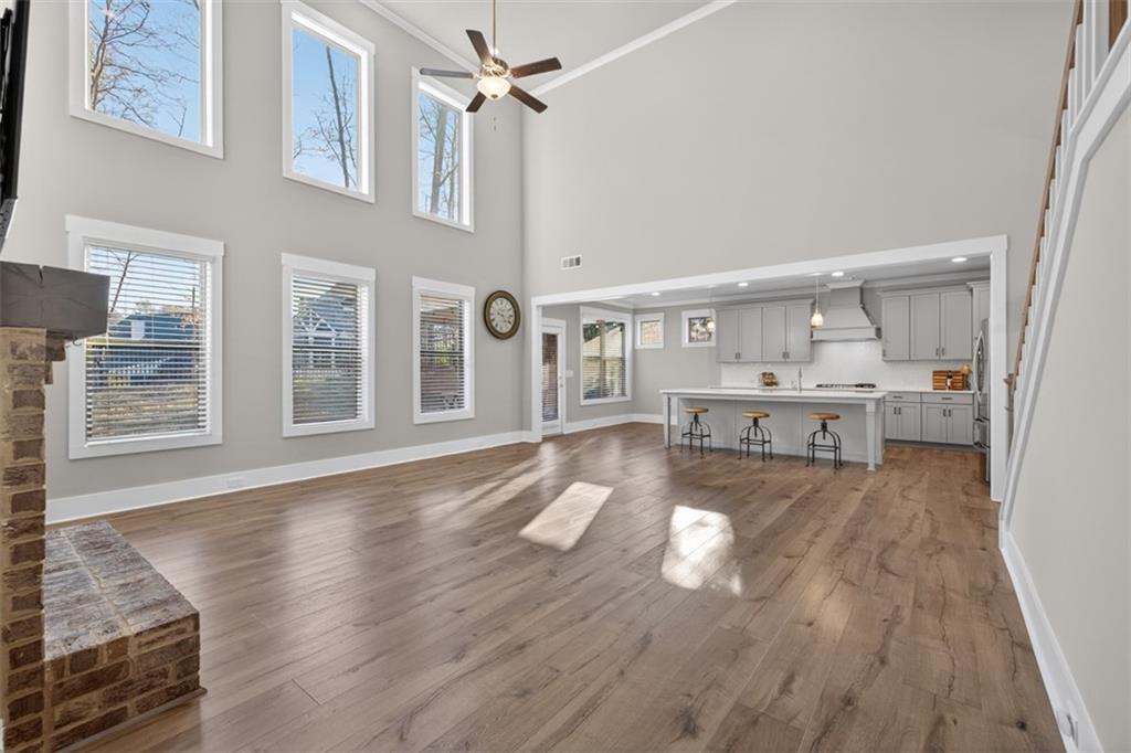 2588 Traditions Way Jefferson, GA 30549 - Photo 18 of 84 a view of a living room with hardwood floor and a kitchen