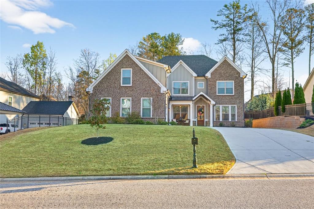 2588 Traditions Way Jefferson, GA 30549 - Photo 2 of 84 a front view of a house with a yard
