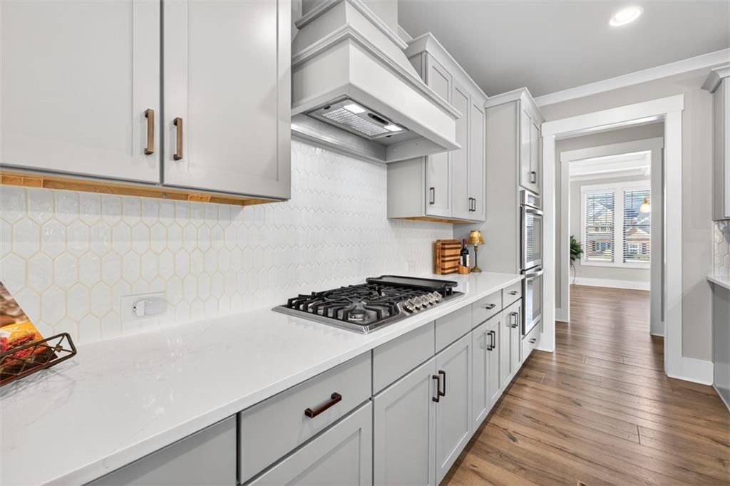 2588 Traditions Way Jefferson, GA 30549 - Photo 23 of 84 a kitchen with white cabinets and appliances