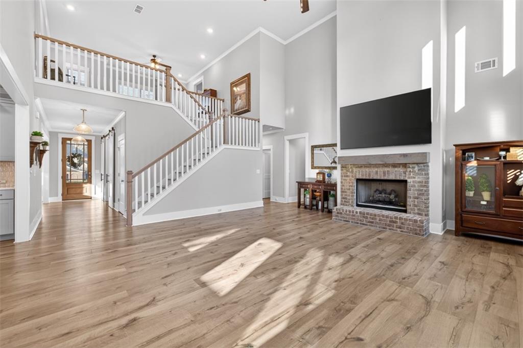2588 Traditions Way Jefferson, GA 30549 - Photo 27 of 84 a view of a livingroom with an empty space and a fireplace