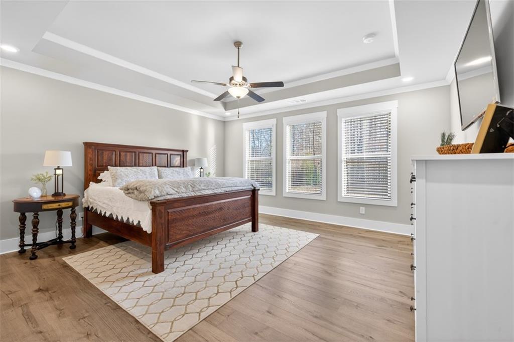 2588 Traditions Way Jefferson, GA 30549 - Photo 28 of 84 a bed sitting in a spacious bedroom next to a window