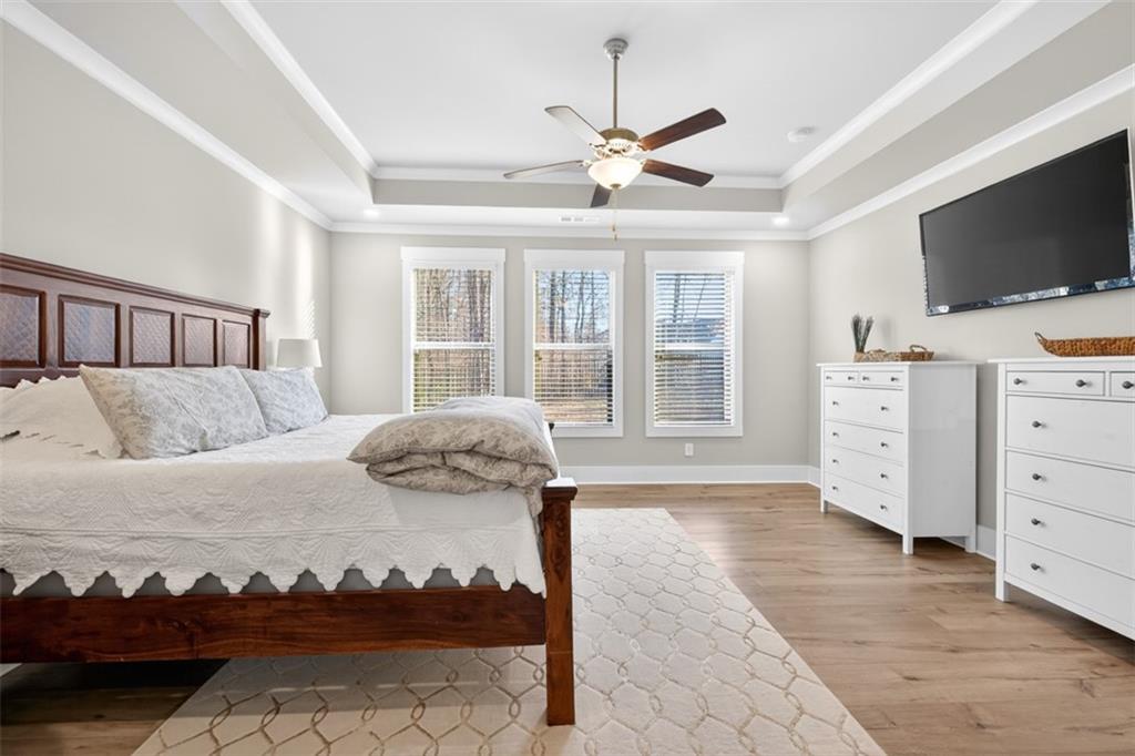 2588 Traditions Way Jefferson, GA 30549 - Photo 29 of 84 a bedroom with a bed and flat screen tv