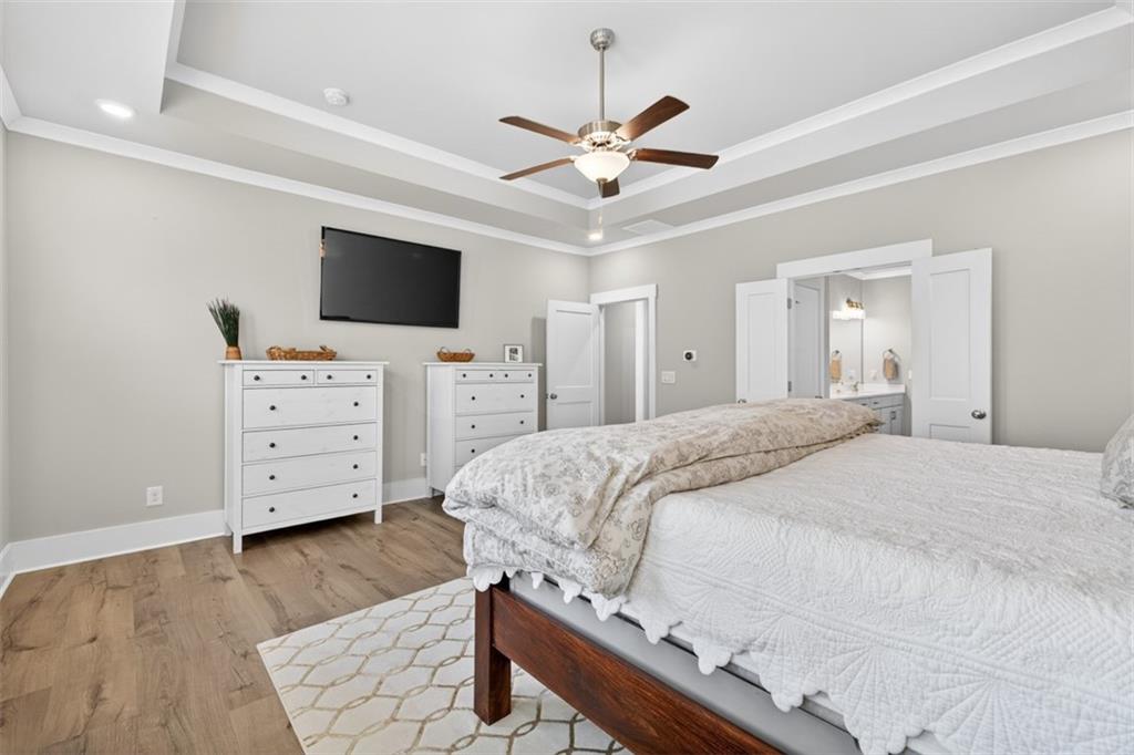 2588 Traditions Way Jefferson, GA 30549 - Photo 31 of 84 a spacious bedroom with a bed and a flat screen tv