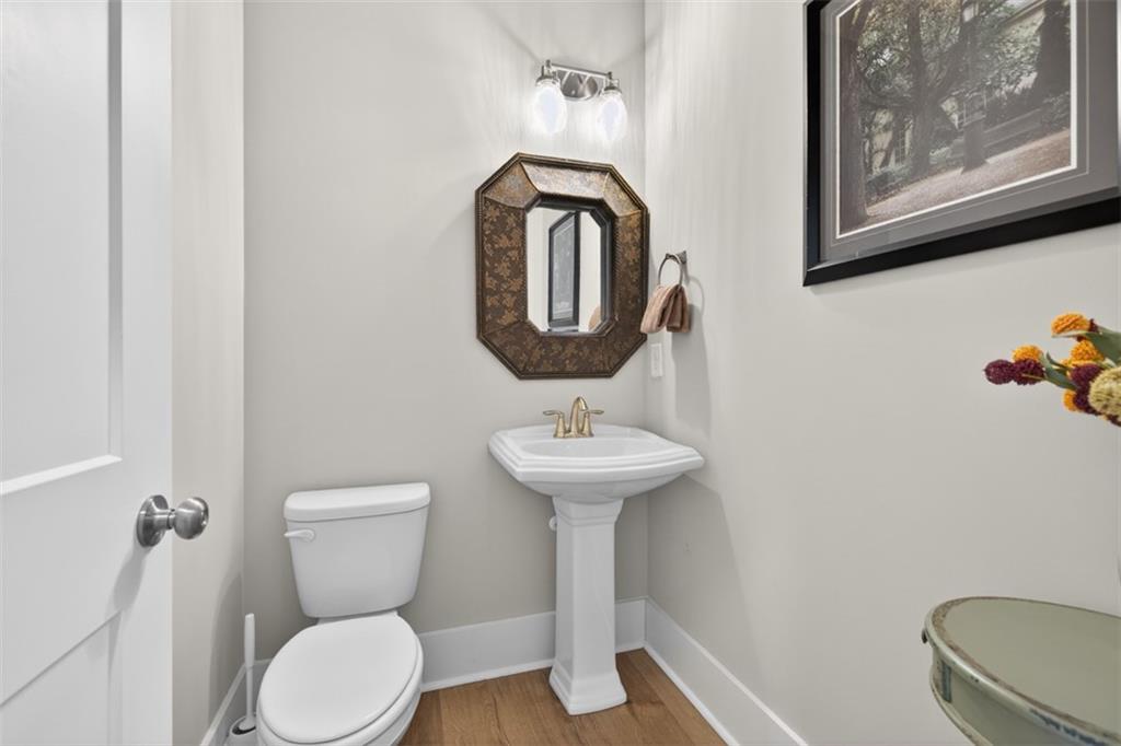 2588 Traditions Way Jefferson, GA 30549 - Photo 39 of 84 a bathroom with a toilet a sink and mirror