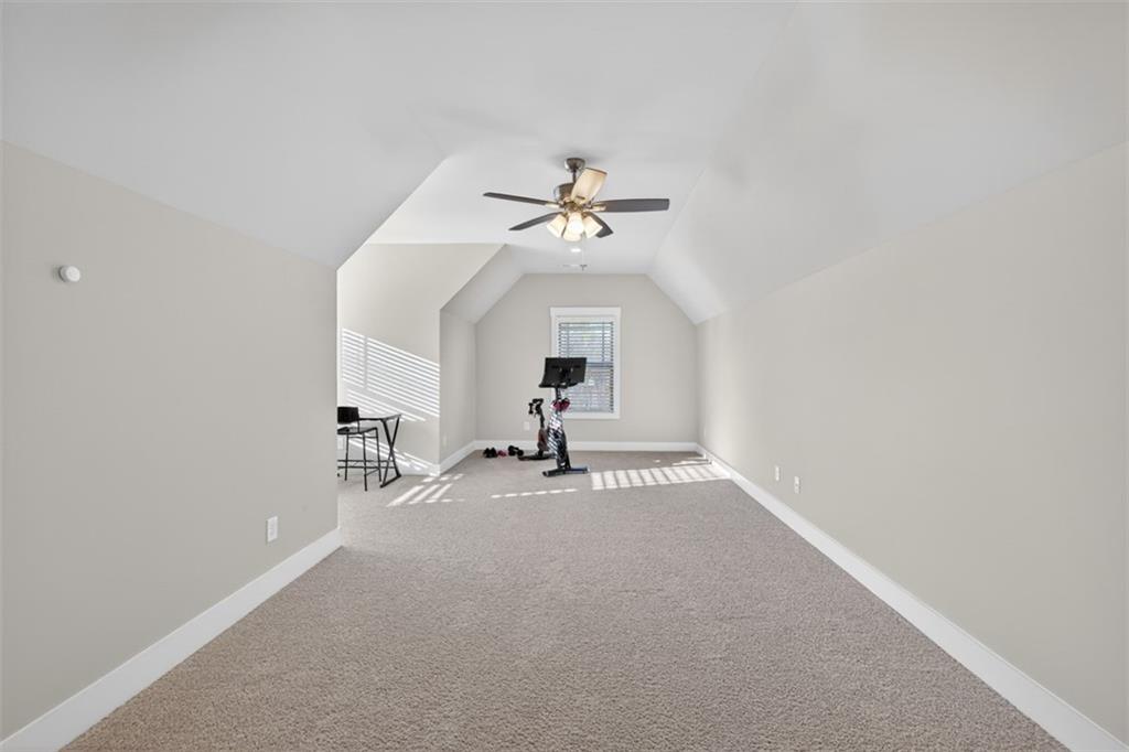 2588 Traditions Way Jefferson, GA 30549 - Photo 51 of 84 a living room with furniture and a chandelier