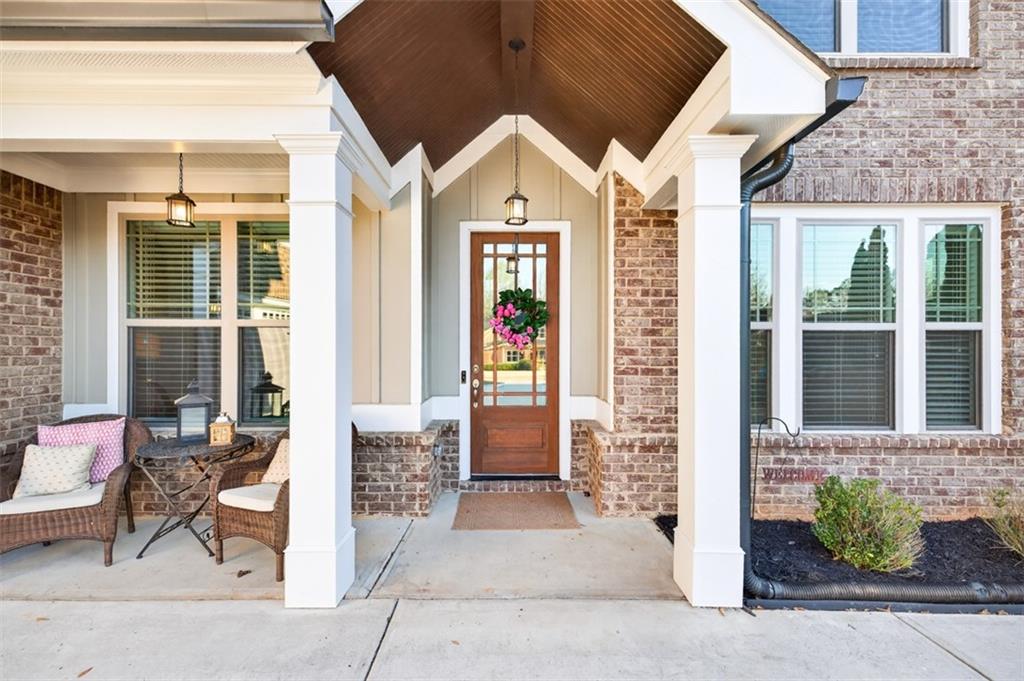 2588 Traditions Way Jefferson, GA 30549 - Photo 64 of 84 a front view of a brick house with a large windows