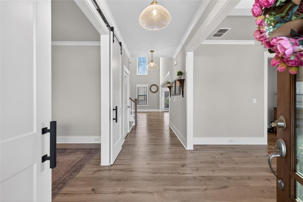 2588 Traditions Way Jefferson, GA 30549 - Photo 7 of 84 a view of a hallway with wooden floor and entryway