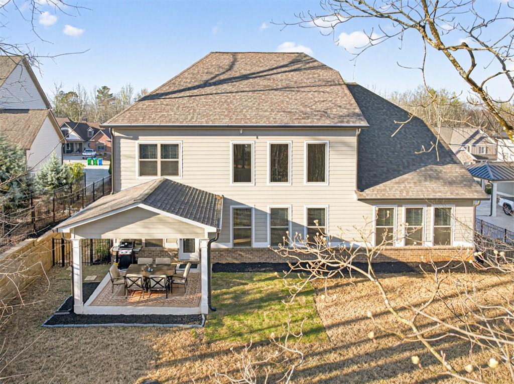 2588 Traditions Way Jefferson, GA 30549 - Photo 83 of 84 a view of a white house with swimming pool and porch