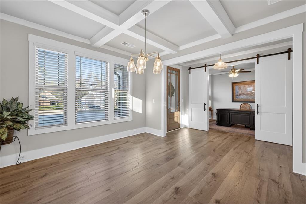 2588 Traditions Way Jefferson, GA 30549 - Photo 10 of 84 a view of an empty room with wooden floor and a window