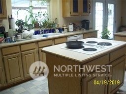 4407 Rd L Northeast Moses Lake, WA 98837 - Photo 5 of 6 a kitchen with a sink and a stove