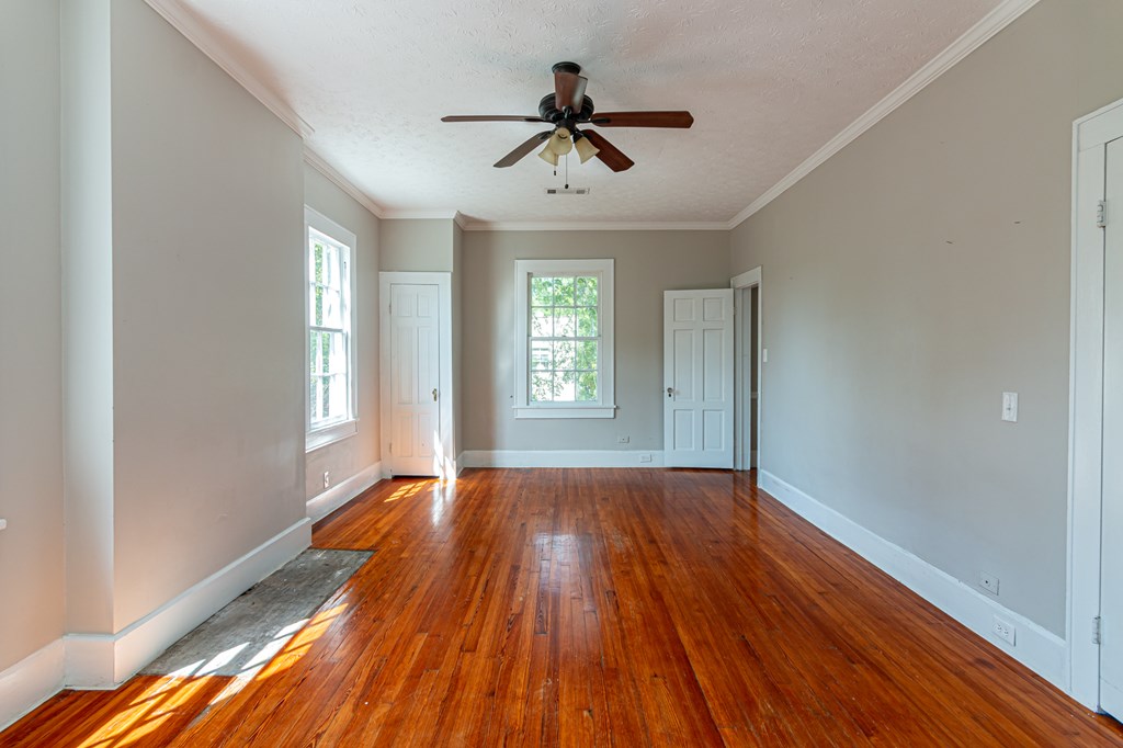 1519 16th Avenue Columbus, GA 31901 - Photo 13 of 16 a view of empty room with wooden floor and fan