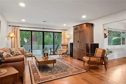 a living room with furniture and a rug