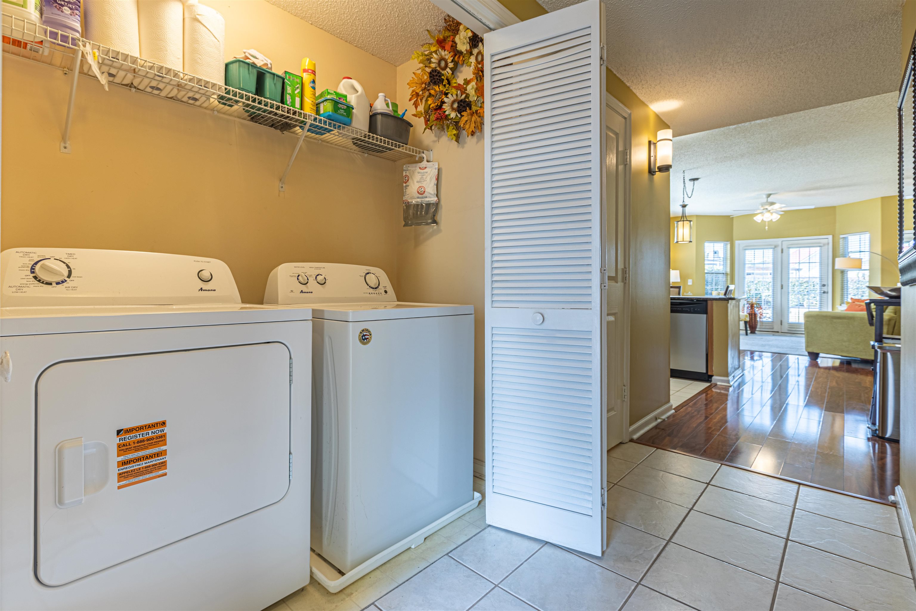 4603 Arran Court, Unit A Myrtle Beach, SC 29579 - Photo 21 of 32 Laundry room with a textured ceiling, light tile patterned floors, separate washer and dryer, and a ceiling fan