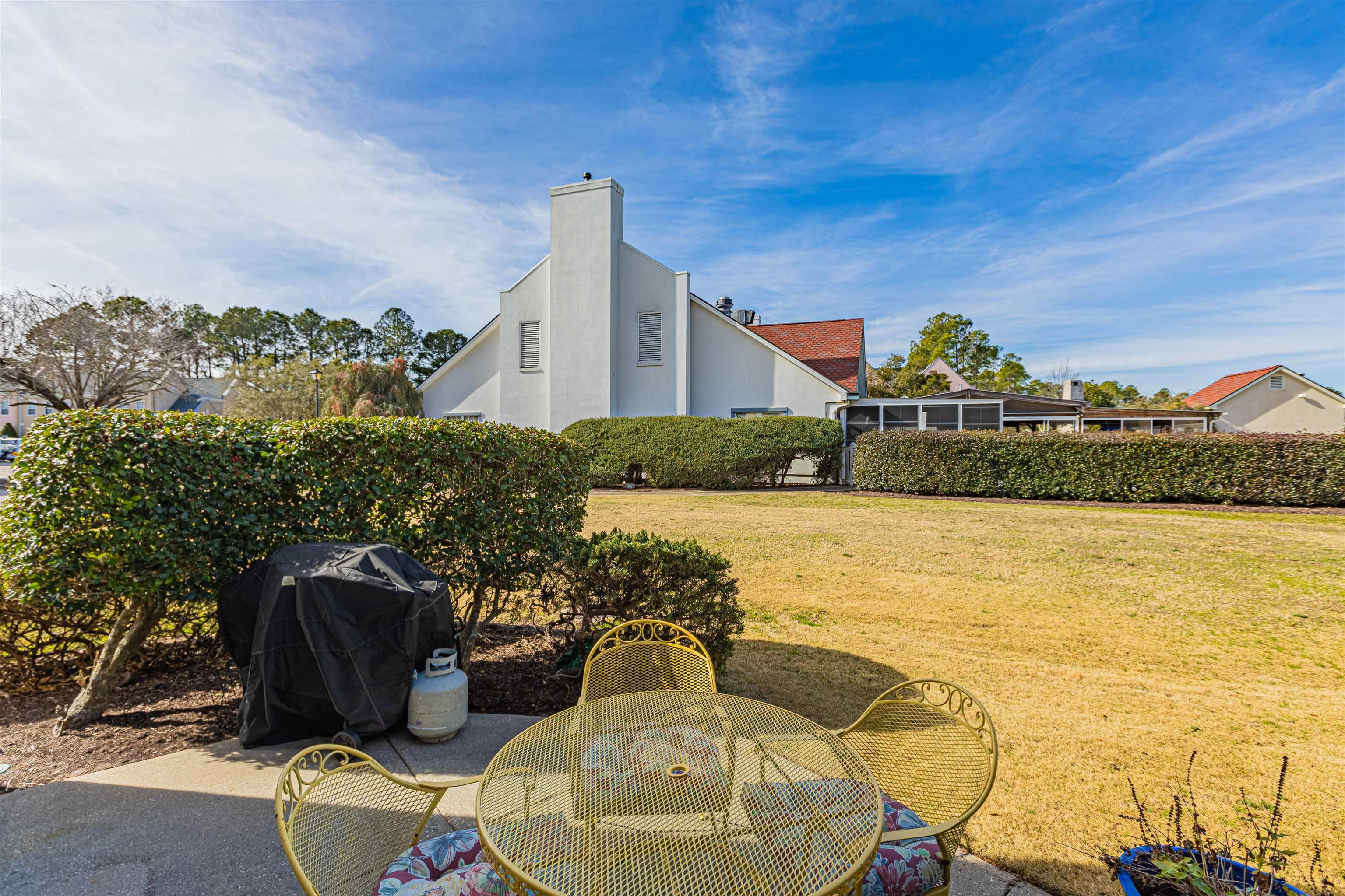4603 Arran Court, Unit A Myrtle Beach, SC 29579 - Photo 23 of 32 View of grassy yard with outdoor dining area