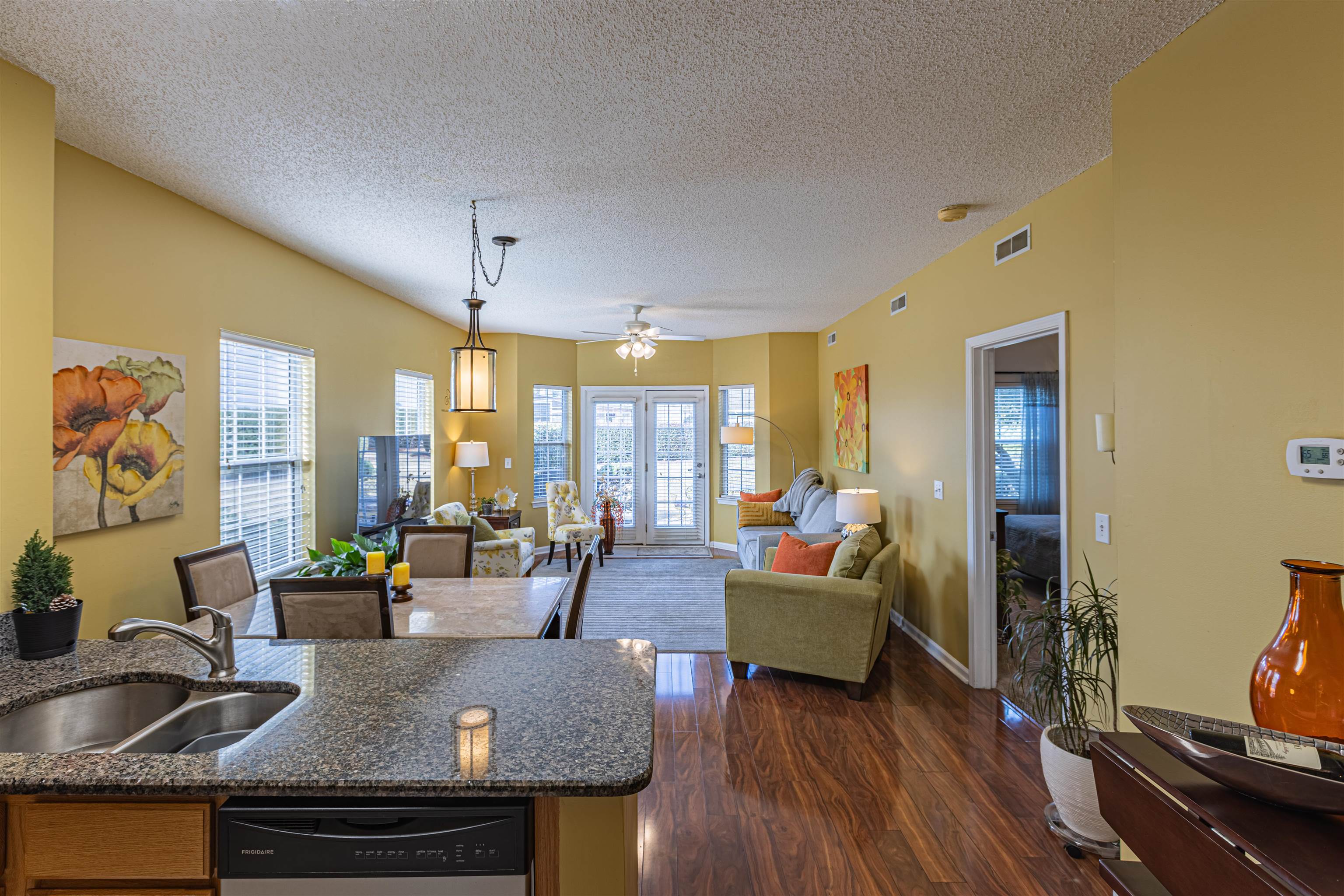 4603 Arran Court, Unit A Myrtle Beach, SC 29579 - Photo 32 of 32 Kitchen featuring open floor plan, stainless steel dishwasher, a ceiling fan, dark wood finished floors, and a textured ceiling