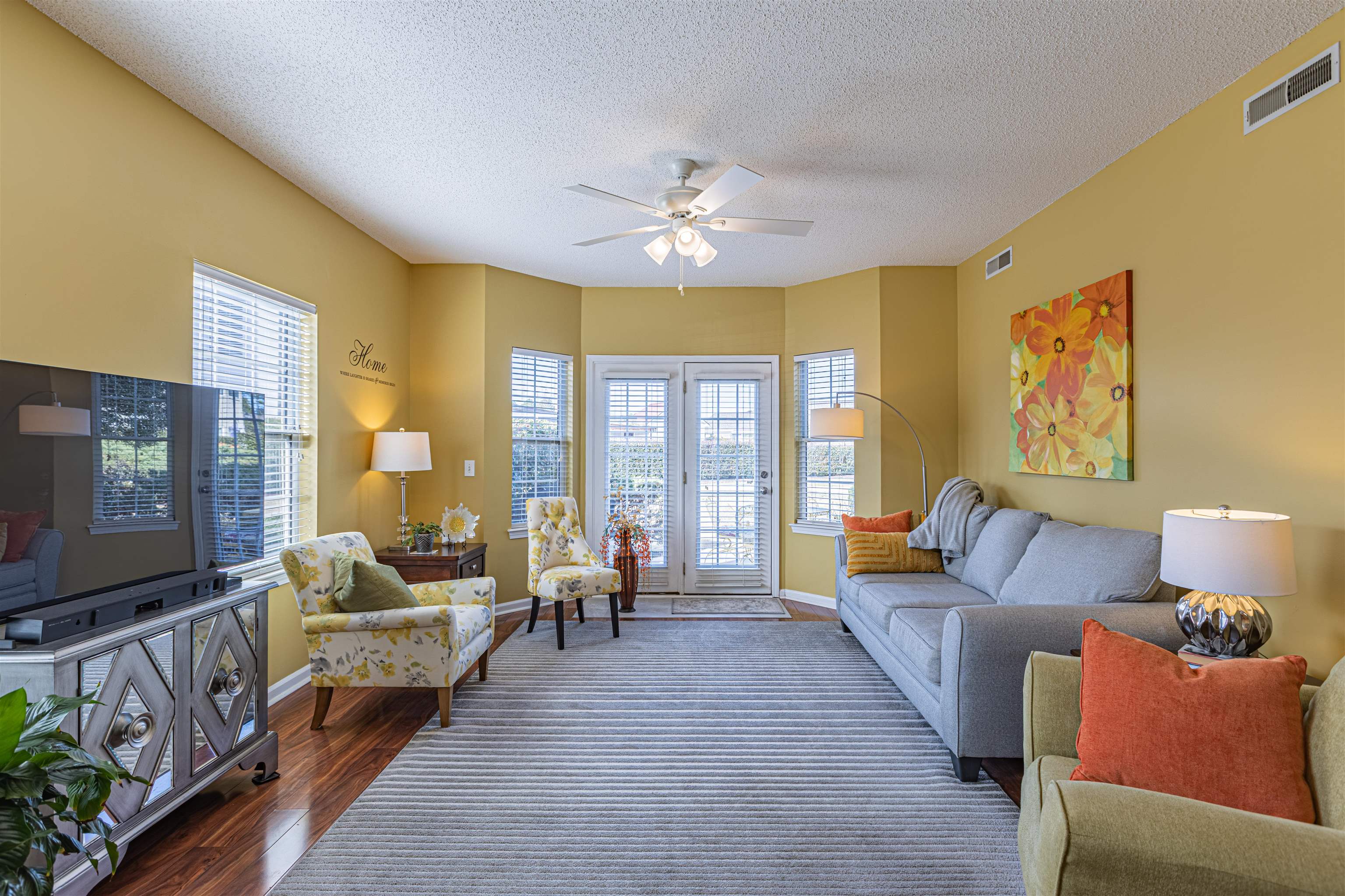 4603 Arran Court, Unit A Myrtle Beach, SC 29579 - Photo 6 of 32 Living room featuring plenty of natural light, dark wood finished floors, a textured ceiling, and a ceiling fan
