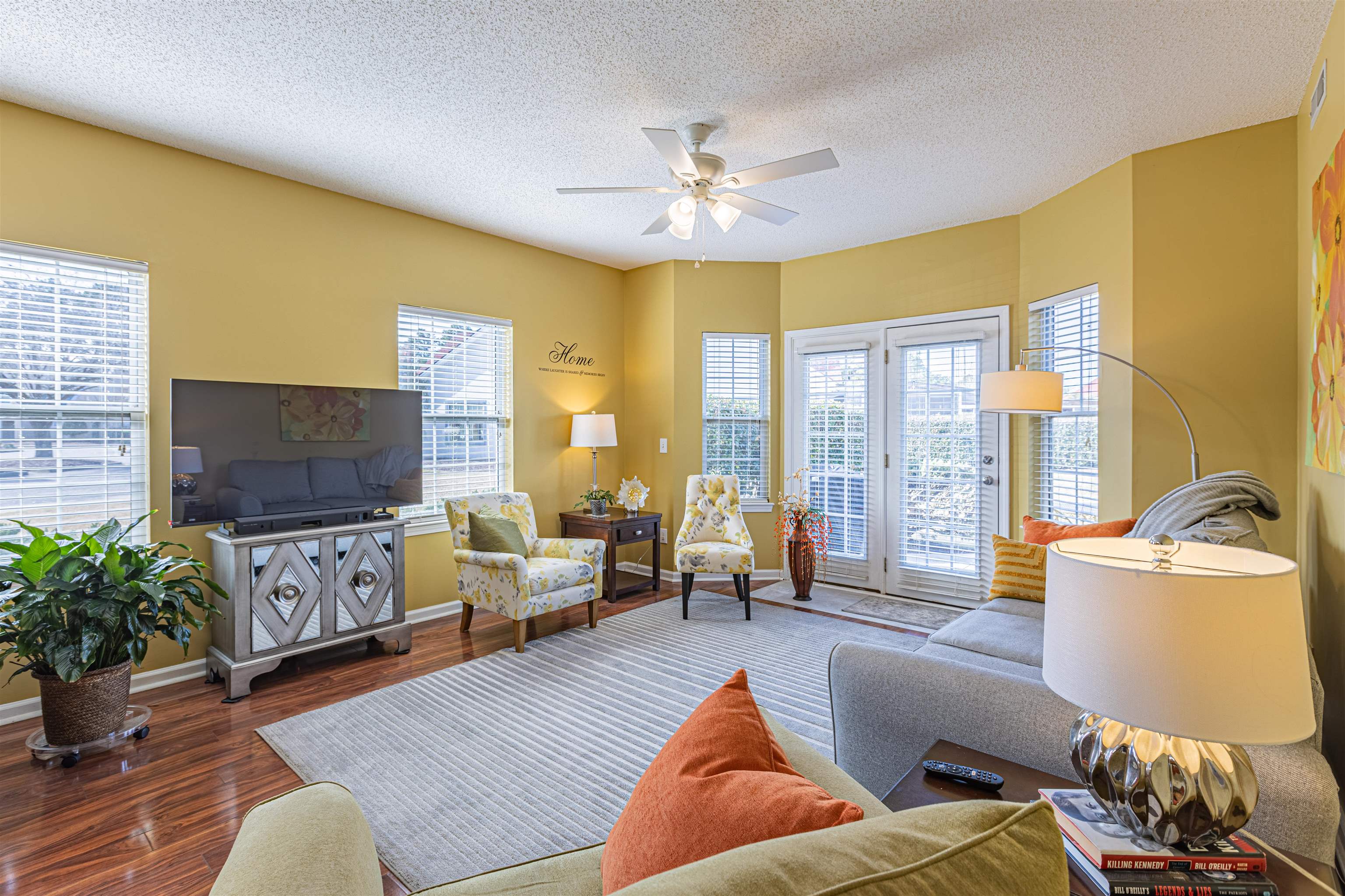 4603 Arran Court, Unit A Myrtle Beach, SC 29579 - Photo 7 of 32 Living area featuring wood finished floors, a textured ceiling, plenty of natural light, and a ceiling fan