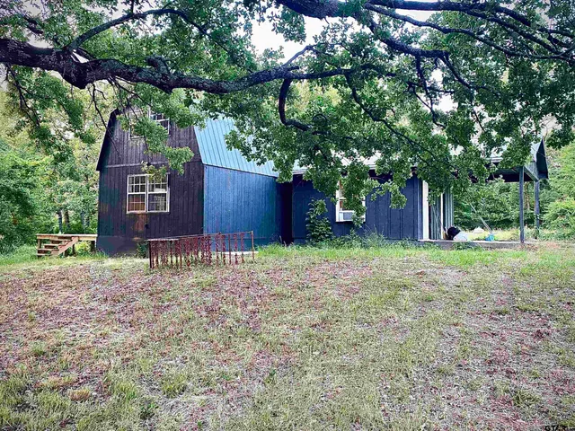 a house view with a backyard space