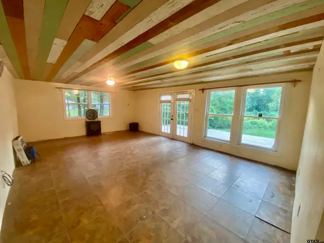 a view of livingroom with an empty space and a window