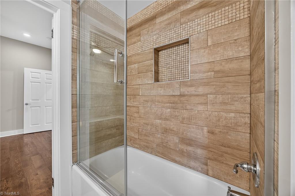 937 Haynes Road Summerfield, NC 27358 - Photo 21 of 50 Jack & Jill style bathroom between rooms on main level.