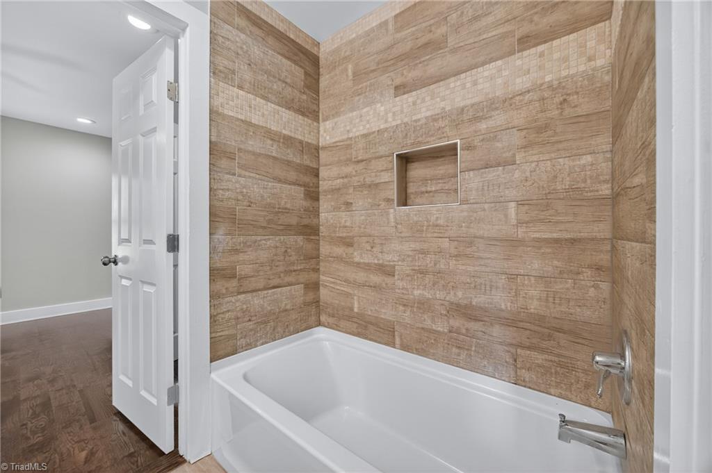 937 Haynes Road Summerfield, NC 27358 - Photo 32 of 50 Jack & Jill style bathroom between rooms on second floor.