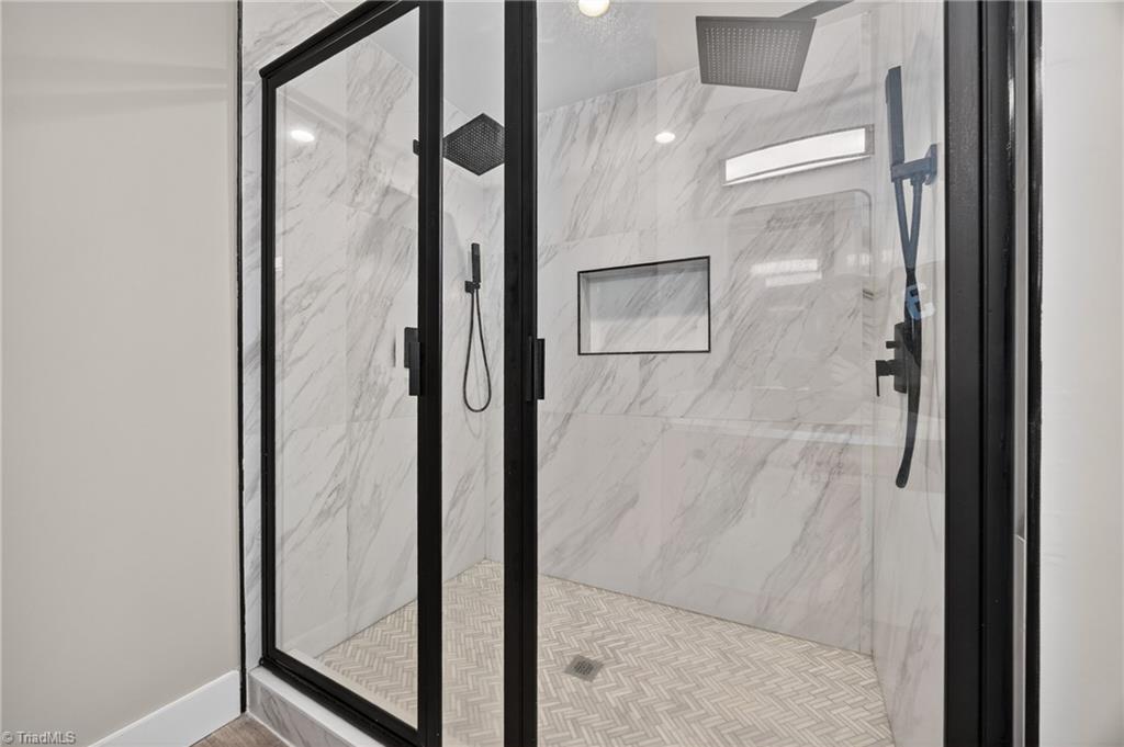 937 Haynes Road Summerfield, NC 27358 - Photo 39 of 50 Walk-in shower in primary ensuite (Upstairs).bathroom