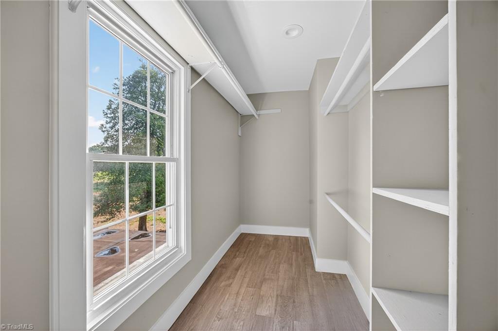 937 Haynes Road Summerfield, NC 27358 - Photo 40 of 50 Walk-in closet in primary ensuite bathroom (Upstairs).