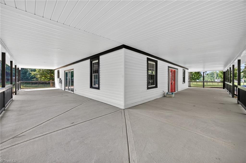 937 Haynes Road Summerfield, NC 27358 - Photo 6 of 50 1600 ft.² of wraparound porch.
