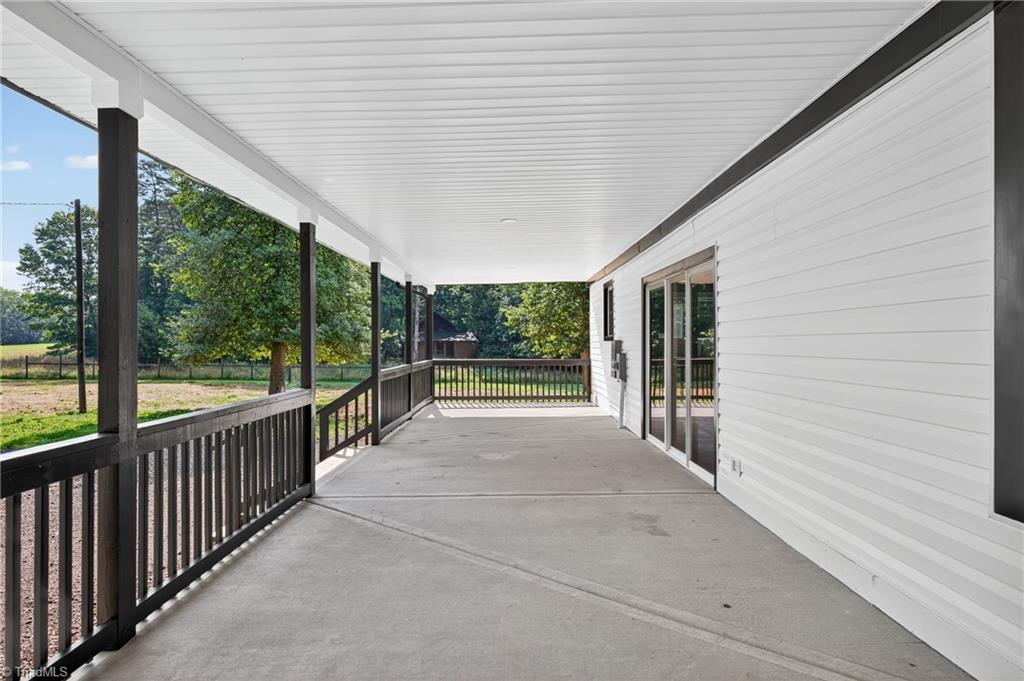 937 Haynes Road Summerfield, NC 27358 - Photo 7 of 50 1600 ft.² of wraparound porch.