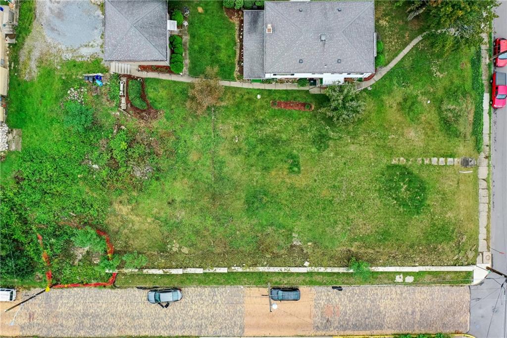 930 State Avenue Coraopolis, PA 15108 - Photo 9 of 12 an aerial view of a house with a yard and large trees
