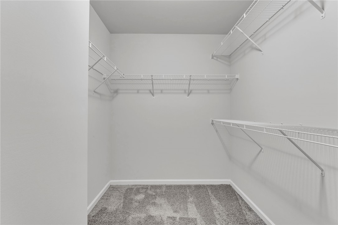 208 Samuel Street Pendleton, SC 29670 - Photo 15 of 32 Ample wire shelving units are ready to organize any wardrobe in this dedicated closet space.
