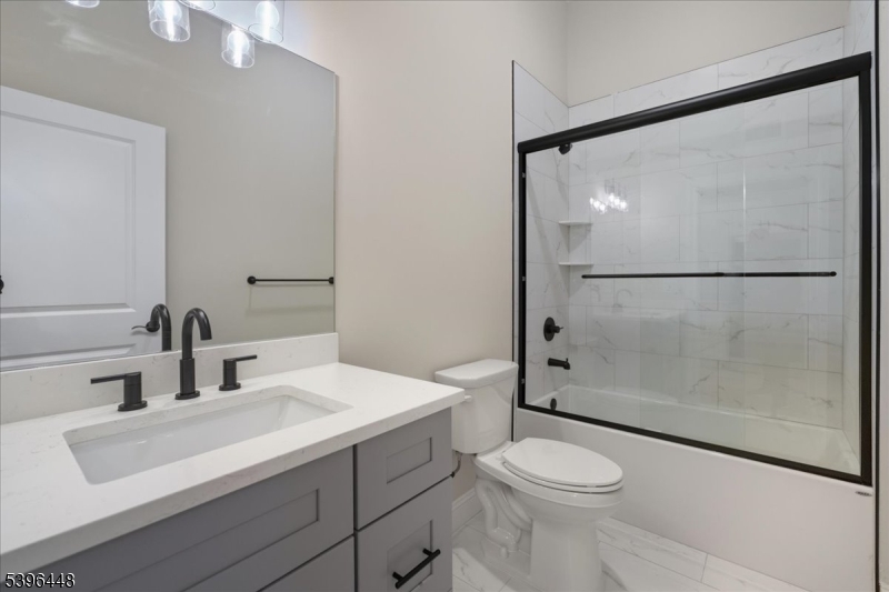 59 High Street, Unit 9 Newton, NJ 07860 - Photo 2 of 4 a bathroom with a sink toilet and shower