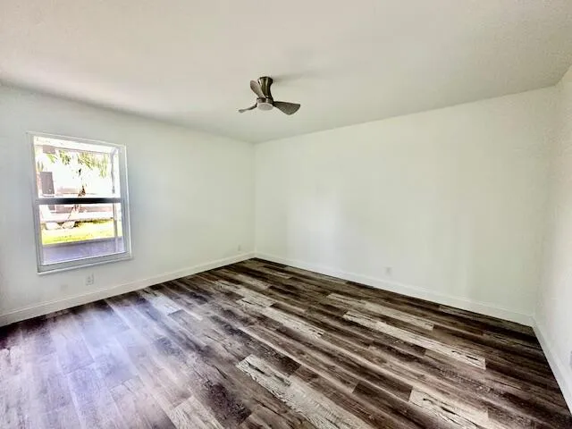 a kitchen with a refrigerator and a stove top oven