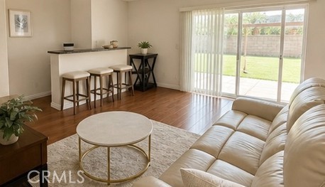 20631 East Vejar Road Walnut, CA 91789 - Photo 3 of 19 a living room with furniture a dining table and a floor to ceiling window