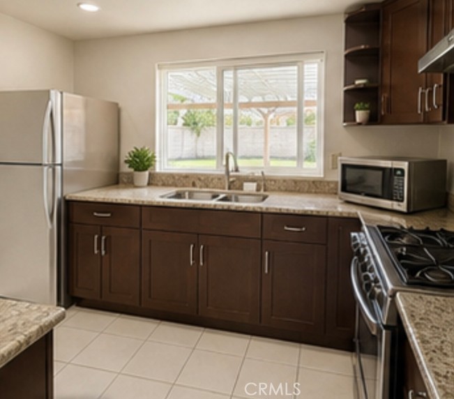 20631 East Vejar Road Walnut, CA 91789 - Photo 5 of 19 a kitchen with stainless steel appliances granite countertop a stove a sink and a refrigerator
